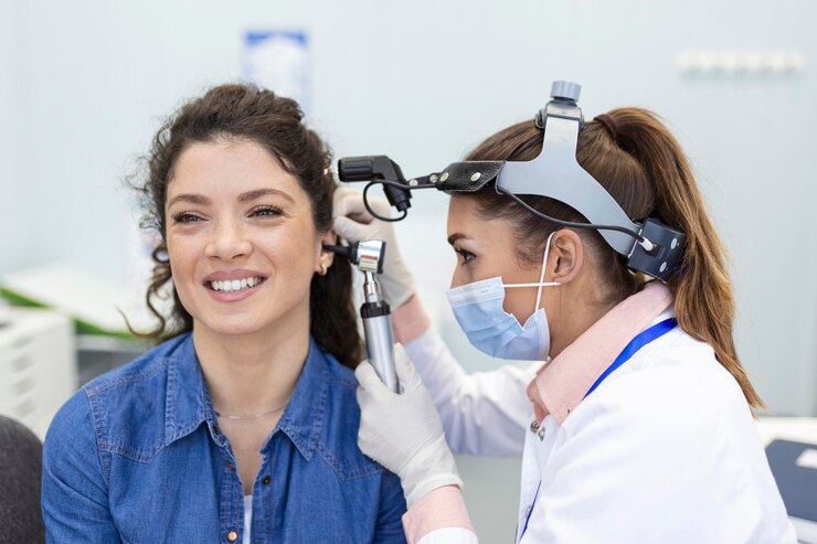 Doctor checking the patient ear