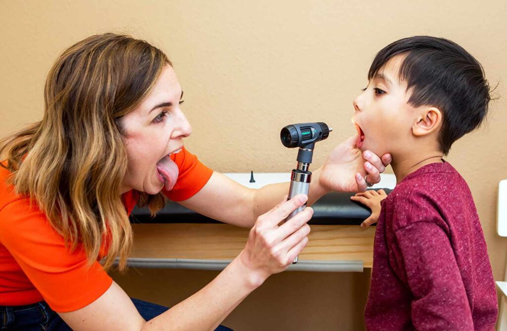 Doctor checking child teeth